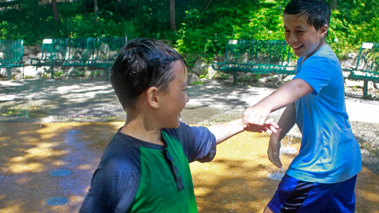 Taking a break from the animals at the Saint Louis Zoo, the children's zoo offers several play areas, including a few wet spots.